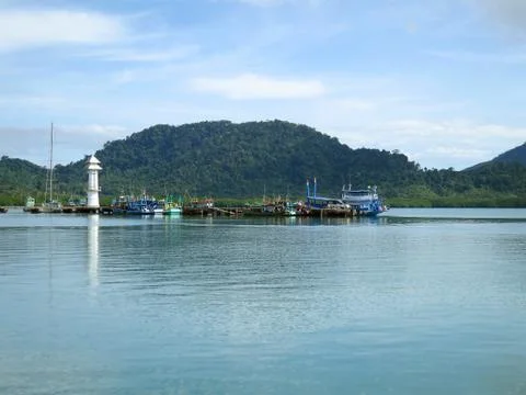 Jetty with lighthouse Stock Photos