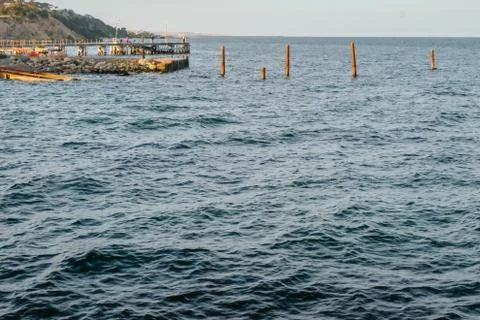 Jetty on the ocean Stock Photos