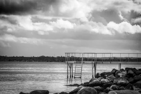 Jetty with a small bridge Stock Photos