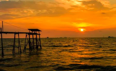 Jetty with sunset background Stock Photos