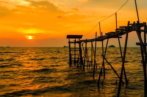 Jetty with sunset background Stock Photos