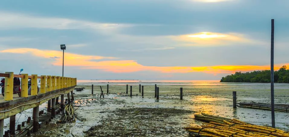 Jetty with sunset Stock Photos