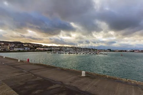 Jetty surrounding Howth harbor Stock Photos