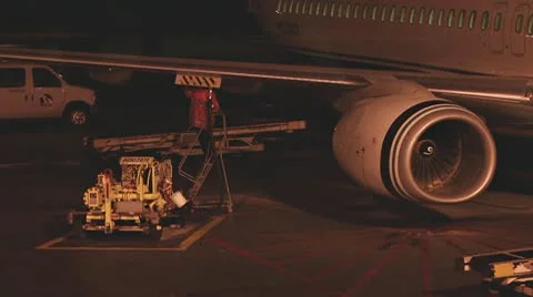 Jetway Worker Refueling Jet at Night 1 Stock Footage 10748823