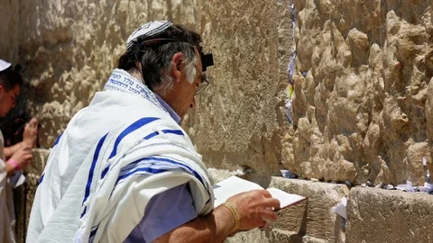Jew pray at the Western Wall in Jerusalem Stock Footage