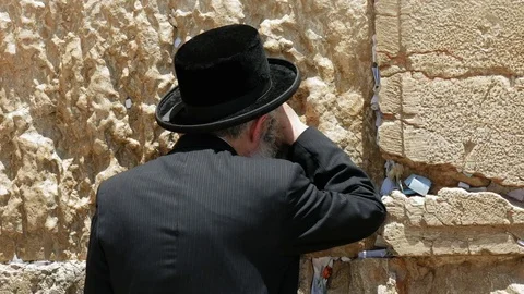 Jew pray at the Western Wall in Jerusalem Stock Footage