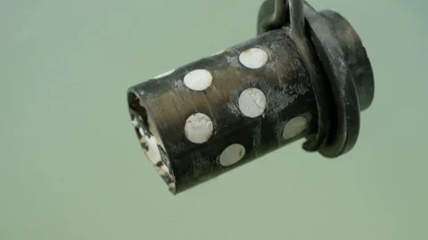 The jeweler cools the heated plaster mold for making jewelry in cold water Stock Footage 126230890