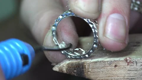 Jeweler creates a silver ring Stock Footage 145009894
