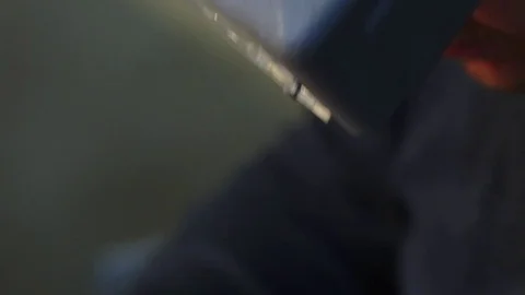 Jeweler looking at the ring through glasses in a workshop Видео 71400341