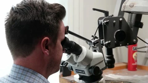 Jeweler Looks Through The Microscope Stock-Footage 132441580
