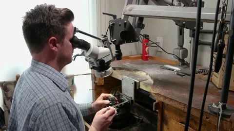 Jeweler Looks Through The Microscope While Working With A Ring Stock Footage 132004933