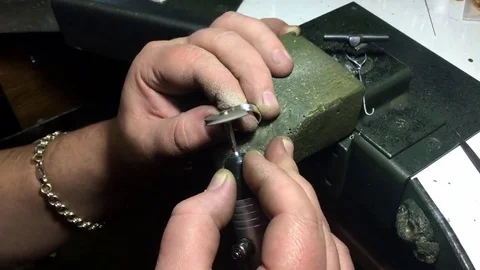 Jeweler makes a ring of silver in the workshop Stock Footage 72961324