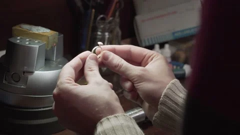 Jeweler processes the wedding ring after casting. Stock Footage 147415682