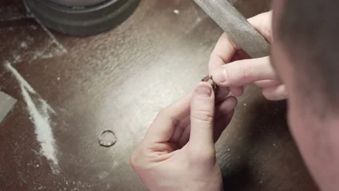 Jeweler processes the wedding ring after casting. Stock Footage 153549286