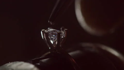 Jeweler Setting Precious Gemstone in Ring with Bright Illumination Stock-Footage 260089872