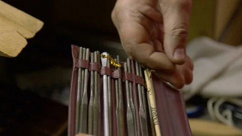 Jeweler in the workshop chooses the right tool Stock Footage 108342844