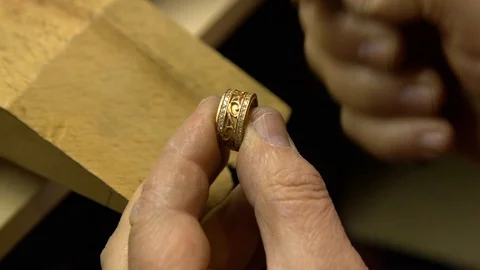 Jeweler in the workshop cleans the ring Stock Footage 108343557