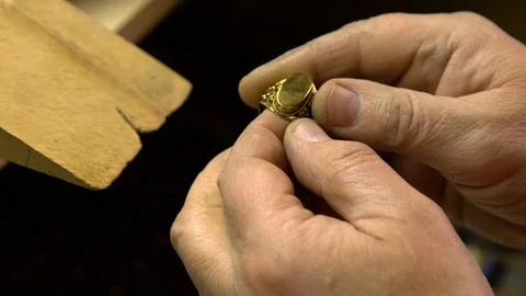 Jeweler in the workshop cleans the ring Stock Footage 108343750
