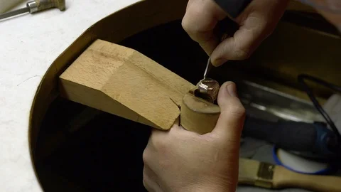 Jeweler in the workshop engraves the ring Stock Footage 108342658