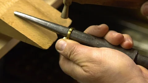 Jeweler in the workshop increases the size of the ring Stock Footage 108343655