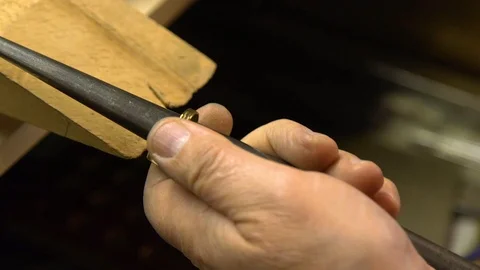 Jeweler in the workshop increases the size of the ring Stock Footage 108343658
