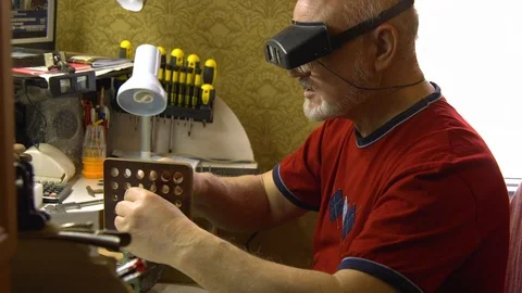 Jeweler in the workshop pulls the chain through the fellier Stock Footage 108343344