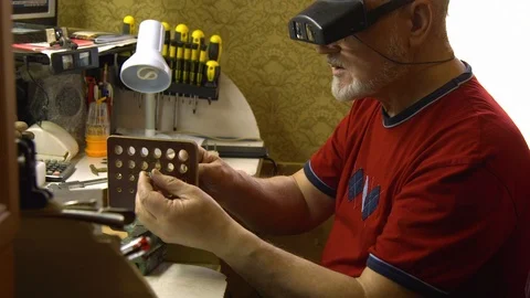Jeweler in the workshop pulls the chain through the fellier Stock Footage 108343384