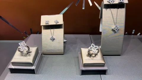 Jewelry Boutique Window Display Pan Shot Left to Right | Diamond Rings, Earrings Stock Footage 345700053