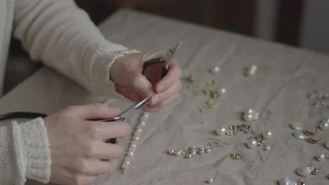 Jewelry designer working in studio with tools making jewelry items Stock Footage 132059676