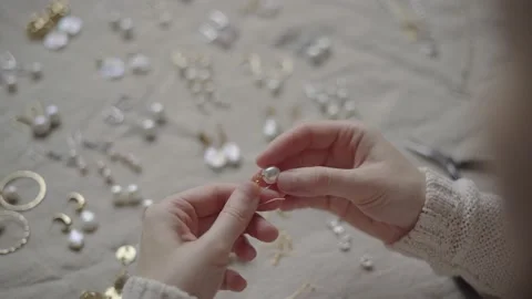 Jewelry designer working in studio with tools making jewelry items with pearl Stock Footage 132060362