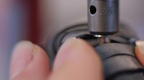 Jewelry maker fingers using press on gum macro Stock-Footage 59620607