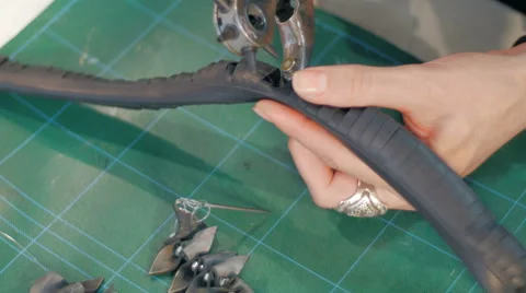 Jewelry maker making holes in gum slide 스톡 동영상 59608356