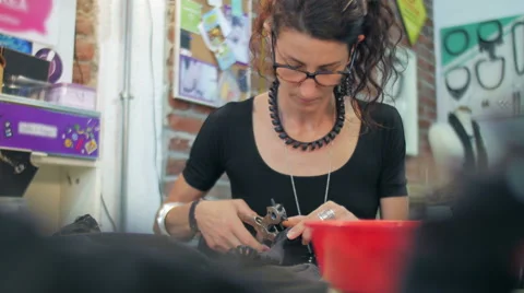 Jewelry maker making holes medium shot Stock Footage 59608566