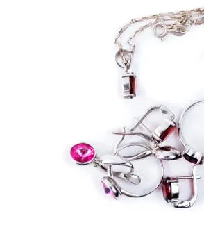 Jewelry with the ruby stones on the white Stock Photos