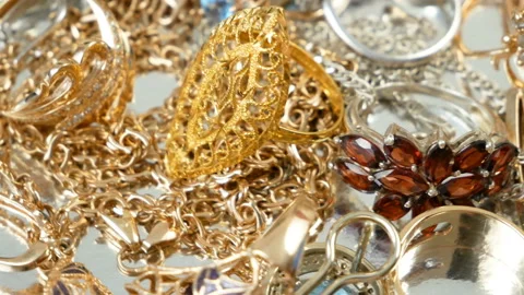Jewelry scrap of gold and silver and money, pawnshop concept Stock Footage