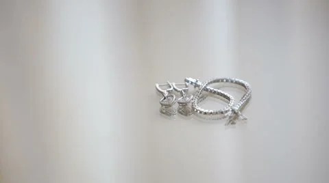 Jewelry on a white table mirror Stock Footage 46174553
