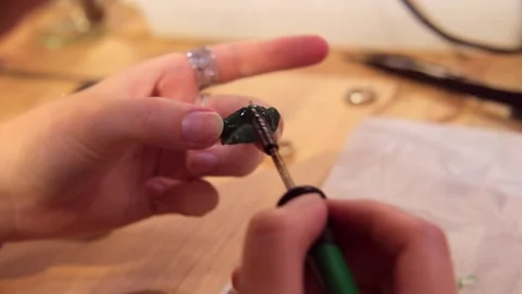 Jewelry workshop, ring sharpening with a drill Stock Footage 283000595