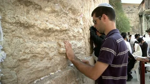 Jewish Guy Puts a Note with Pray at the Western Wall Stock Footage 18085047