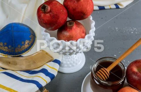 A jewish new year with honey for the apple and pomegranate holiday of Rosh Ha Stock Photos