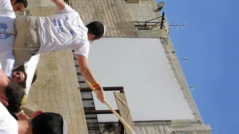 Jews dancing in a round with flag in Jerusalem Stock Footage 91160213