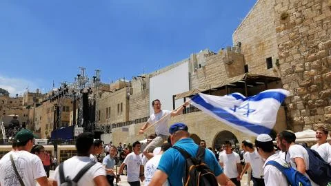 Jews dancing in a round with flag in Jerusalem Stock Photos
