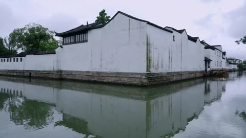 Jiangnan ancient building with white wall by canal, Suzhou water town Stock Footage 345296394