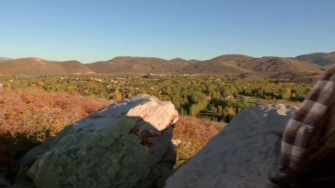 Jib arm move of a young, attractive couple looking at a view of Park City, Utah. Stock Footage 122145473