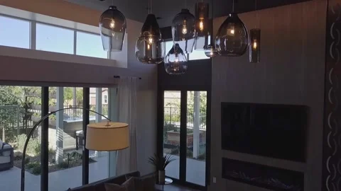 Jib from Ceiling Lights to Couch Stock Footage 154332811