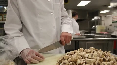 Jib down chef cutting mushrooms Stock Footage 10681365