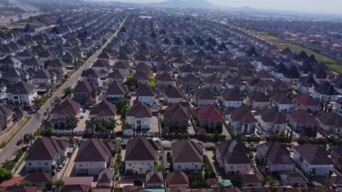 Jib down of long rows of large luxury homes in a newly built suburban Stock Footage 332835745