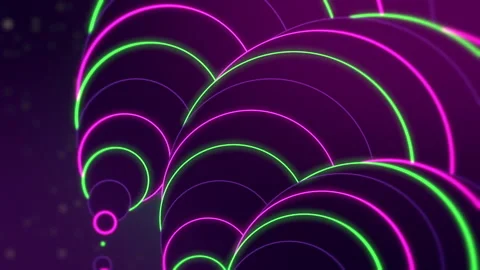 Jib down revealing a group of neon green and violet circles of different sizes. Video stock 145389937