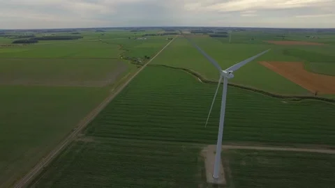 Jib Down of Wind Turbine from Behind Stock Footage 329617621