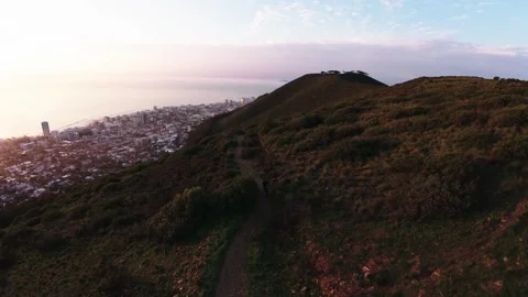 Jib up drone shot of a runner on the mountain golden light Stock Footage 338227414
