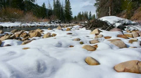 Jib up mountain river and snow Video stock 22062049